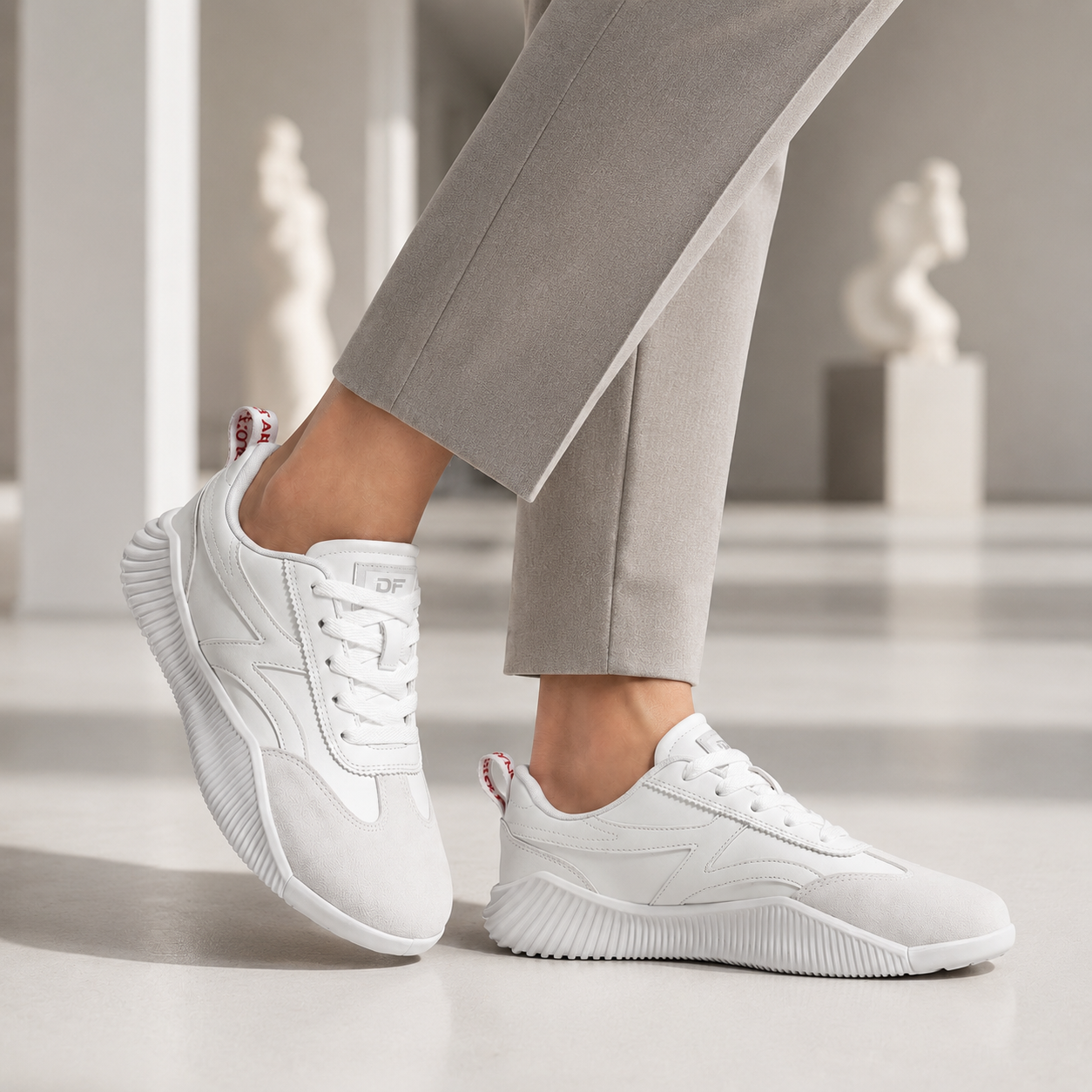 Woman walking in DeFlorance Cloudea 2.0 sneakers in Triple White